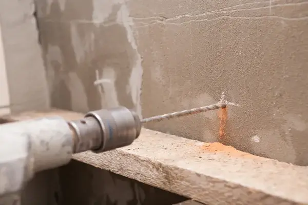 Concrete wall being drilled with precision by Concrete Cutters Auckland.