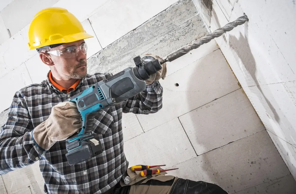 Professional demonstrating efficient concrete drilling for Concrete Cutters Auckland.
