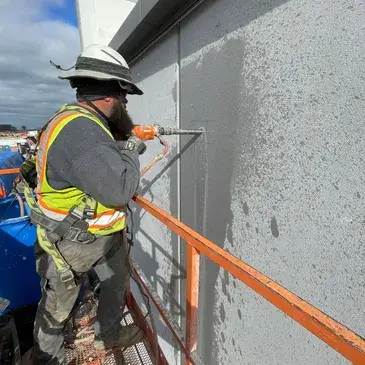 Worker using advanced equipment for concrete drilling, Concrete Cutters Auckland.