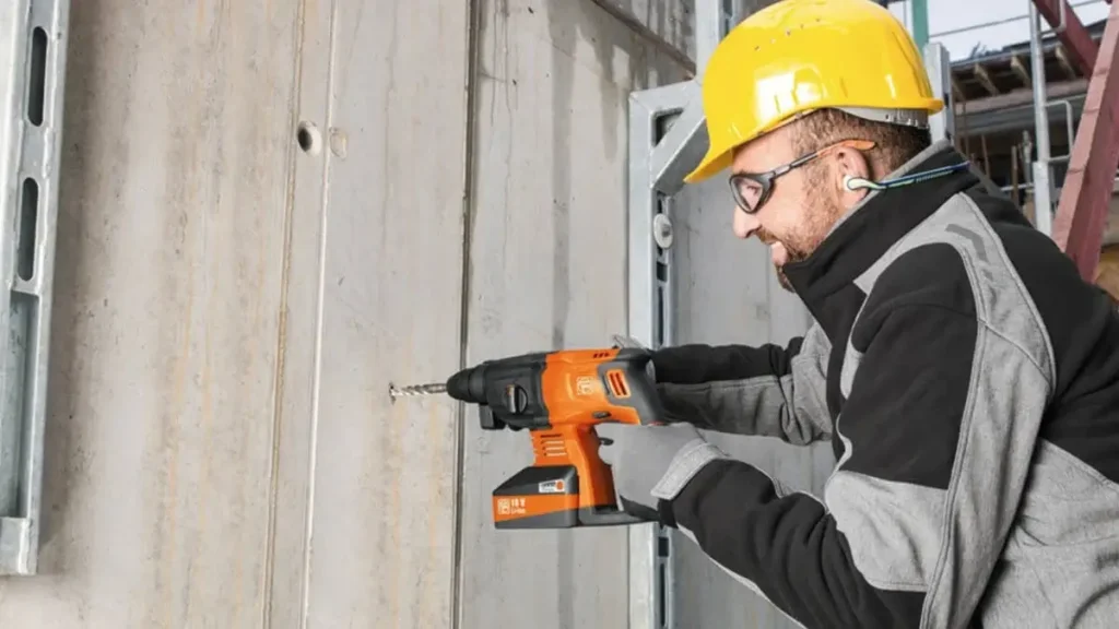 Concrete Drilling Auckland contractor performing precise drilling on a concrete wall using professional equipment.